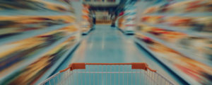 Blurred grocery store isle to represent complexity of FMCG marketing compliance requirements